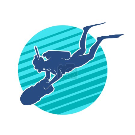 Silhouette of a female diver carrying underwater torch or dive light while swimming underwater