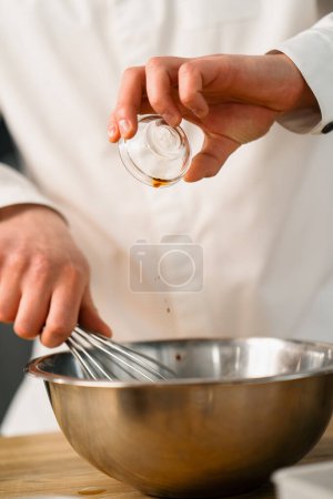 Photo for Professional kitchen chef prepares pancake - Royalty Free Image