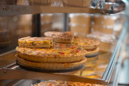 Photo for Delicious Quiche Pie On Shelf Store, Bakery - Royalty Free Image