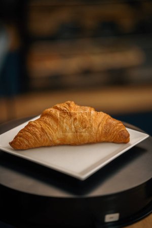 Photo for Close-up, bakery - delicious croissant on rotating surface - Royalty Free Image