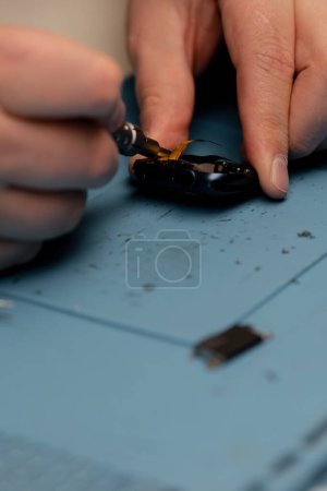 Photo for Macro shot - smart watch being repaired by an engineer - Royalty Free Image