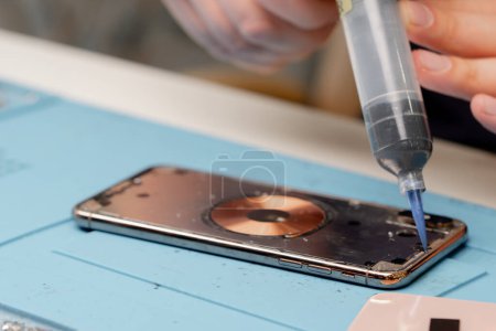 Photo for Macro shot - phone being repaired by an engineer - Royalty Free Image