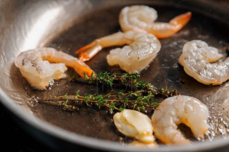 Photo for Professional kitchen in the hotel restaurant close-up seafood fried on pan shrimp squid mussels salmon scallops - Royalty Free Image