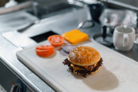 Photo for Professional kitchen in the hotel restaurant freshly prepared smash burger before serving guests - Royalty Free Image