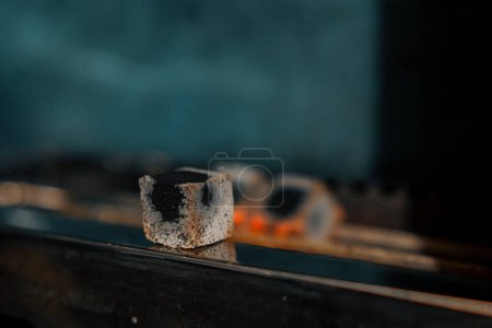 Photo for Hookah coals are roasted on the hookah cooking fire concept of work and leisure - Royalty Free Image