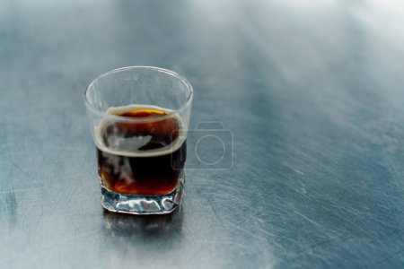 Photo for Delicious aromatic coffee in a cup on a table in restaurant Drink drink for breakfast transparent glass - Royalty Free Image