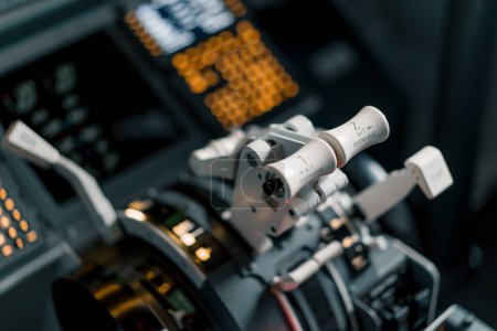 Photo for Pilot's gas lever in airplane cockpit close-up flight details flight simulator - Royalty Free Image