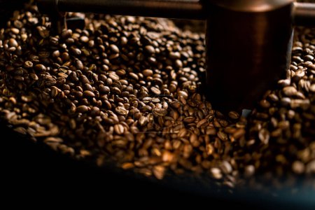 Coffee production is the process of roasting fresh coffee beans coffee beans mixed and cooled close-up