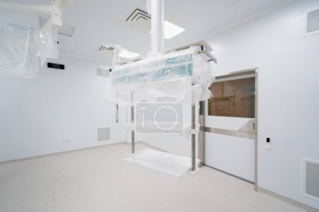Photo for Modern new operating room in hospital clinic packed medical equipment surgery in empty room - Royalty Free Image
