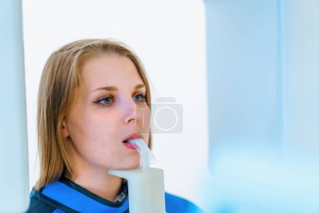 Photo for Scanning of the dental jaw The patient undergoes a procedure of panoramic radiography of oral cavity in modern dentistry - Royalty Free Image