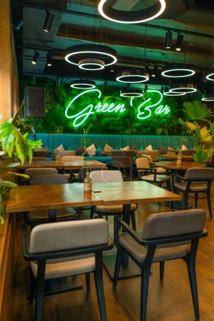 Photo for A bright interior of a restaurant or bar a lot of greenery and plants empty room Asian style - Royalty Free Image