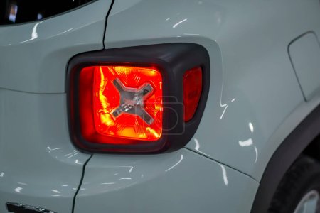 Photo for Close-up of taillight of a luxury white SUV car in the process of detangling and washing the car - Royalty Free Image