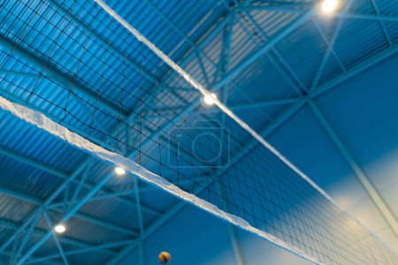 Photo for Close-up sports equipment volleyball net on closed blue court competition matches details - Royalty Free Image