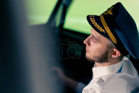 Photo for Portrait of a pilot in the cockpit controlling the plane during flight turbulence flight simulator transportation - Royalty Free Image