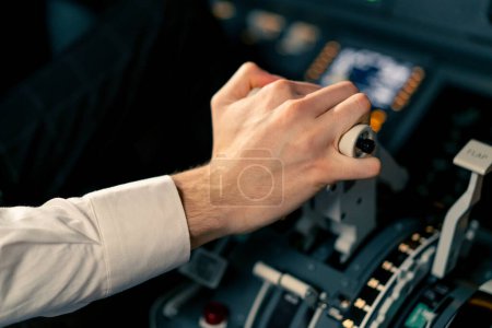 Photo for Airplane pilot controls throttle during flight or takeoff Cockpit view close-up air traffic control - Royalty Free Image
