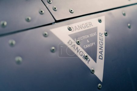 Photo for Close-up of warning signs on the cockpit of flight simulator military aircraft - Royalty Free Image