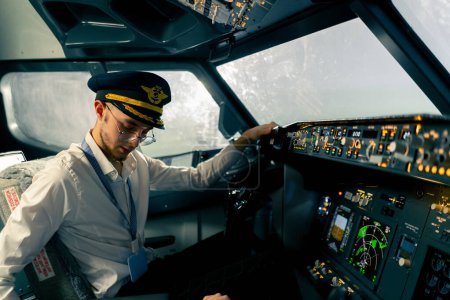 Photo for Young pilots in the cockpit of the plane control air transport during long distance flight simulator - Royalty Free Image