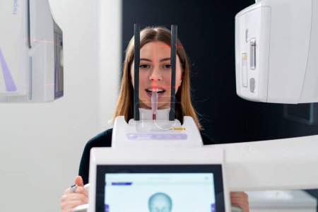 Photo for Portrait of a beautiful woman doing a 3D scan of the nose and oral cavity in plastic surgery clinic - Royalty Free Image