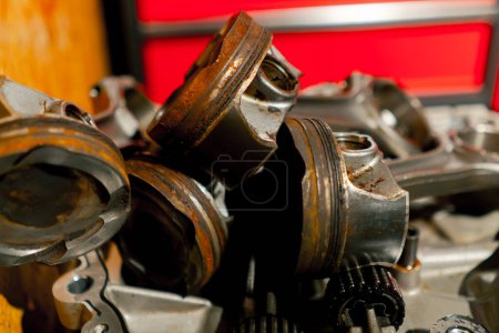 Photo for Close up piston and connecting rod on the table disassembled engine repairing an engine - Royalty Free Image