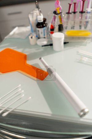 Photo for Close-up in the dental office there are a paraphernalia for teeth whitening on the table - Royalty Free Image