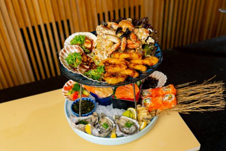 Photo for Close-up in Japanese restaurant an expensive plate of seafood ready to be served to guests - Royalty Free Image