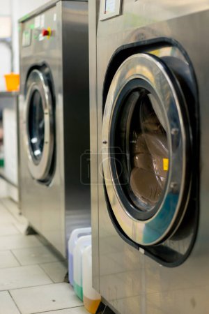 Photo for Close up professional dry cleaning washing machine washing process on professional delicate equipment - Royalty Free Image