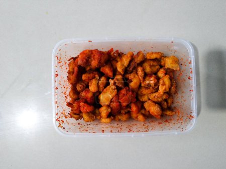 Balado spiced fried chicken on a white background
