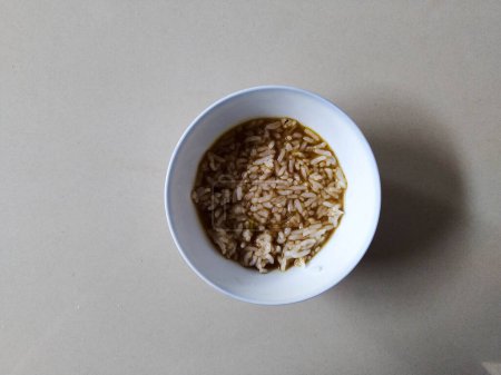 Photo for White rice in a bowl on a white table - Royalty Free Image