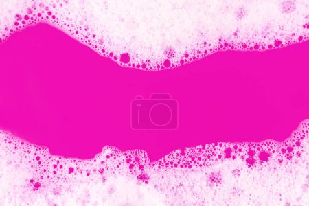 Photo for Foaming liquid on blue backdrop. Cosmetics foam background. Cosmetic product sample of mousse, shampoo or soap. Skincare, cosmetology and beauty concept. Copy space banne - Royalty Free Image