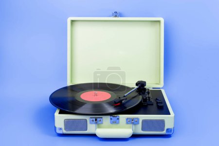 Photo for Vintage vinyl record player isolated on blue background - Royalty Free Image