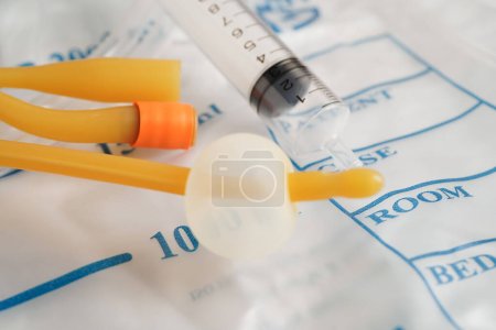 Photo for Foley catheter and urine drainage bag collect urine for disability or patient in hospital. - Royalty Free Image