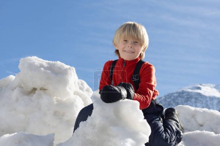 Photo for AUSTRIA, SPORTGASTEIN - March 18, 2023: Event Palmen auf den Almen, boy looking down from the snowy mountain. High quality photo - Royalty Free Image