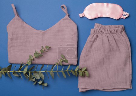 Photo for Flat lay composition with beautiful pajamas on color background, top view. - Royalty Free Image