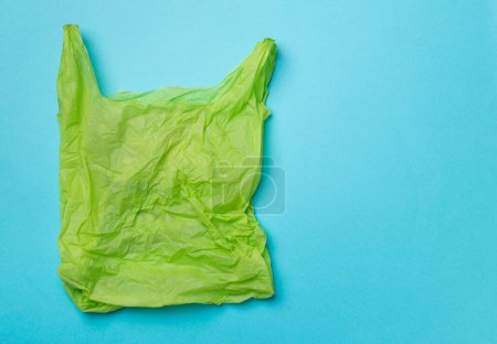 Foto de Disposable plastic bag on color background, top view. - Imagen libre de derechos