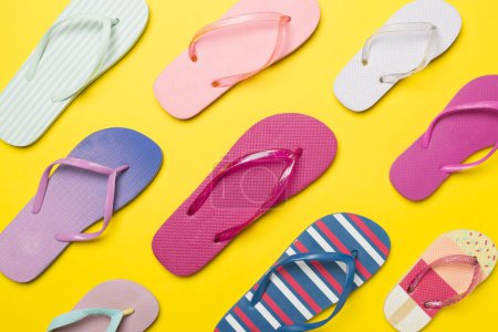 Photo for Many bright flip flops on color background, top view - Royalty Free Image