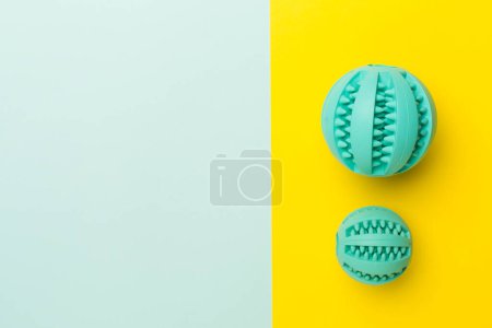 Foto de Blue ball toys for dogs on color background. - Imagen libre de derechos