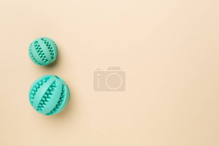Foto de Blue ball toys for dogs on color background. - Imagen libre de derechos