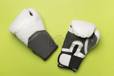 Photo for Martial arts gloves on color background, top view - Royalty Free Image