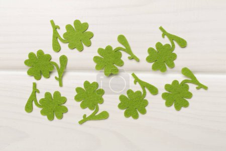 Photo for Felt clover on wooden background, top view. St. Patricks day concept - Royalty Free Image