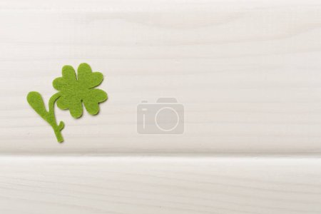 Photo for Felt clover on wooden background, top view. St. Patricks day concept - Royalty Free Image