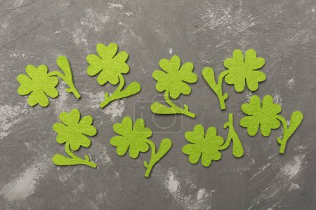 Photo for Felt clover on concrete background, top view. St. Patricks day concept - Royalty Free Image