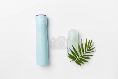 Natural deodorants on color background, top view