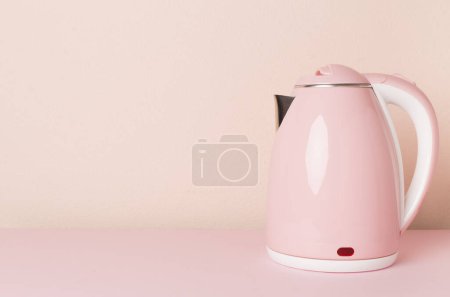Photo for Modern electric pink kettle on color background - Royalty Free Image