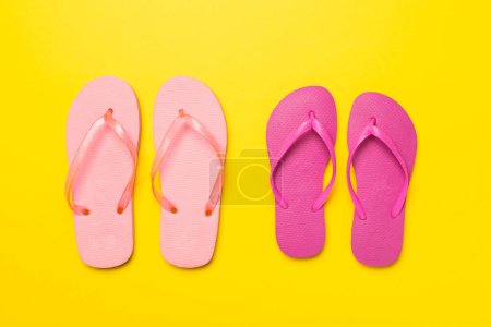 Photo for Many bright flip flops on color background, top view - Royalty Free Image