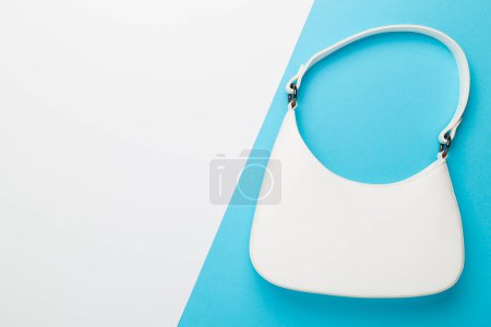 Trendy woman bag on white background, top view