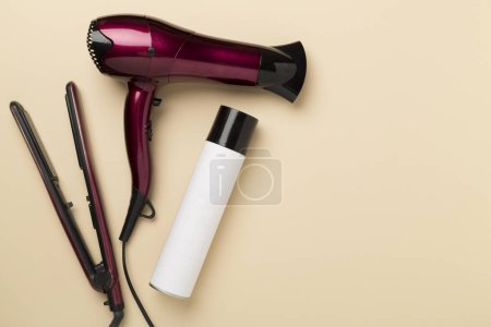 Hair tools with thermo protection on color background, top, view