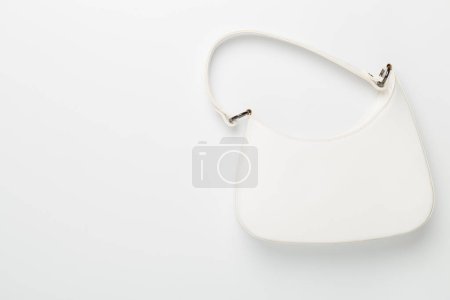 Trendy woman bag on white background, top view