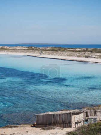 Ses Illetes, paradise empty beach with clear water in Formentera island, vertical shot