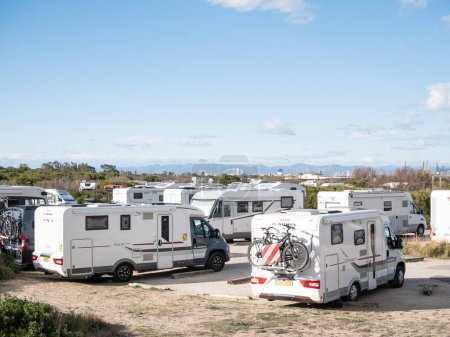 Photo for El Saler, Spain; February 27th 2024: Motor homes on the parking lot of El Saler of Valencia - Royalty Free Image