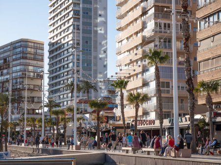 Photo for Benidorm, Spain; March 12th 2024: Tourists at the promenade of Levante Beach in Benidorm - Royalty Free Image
